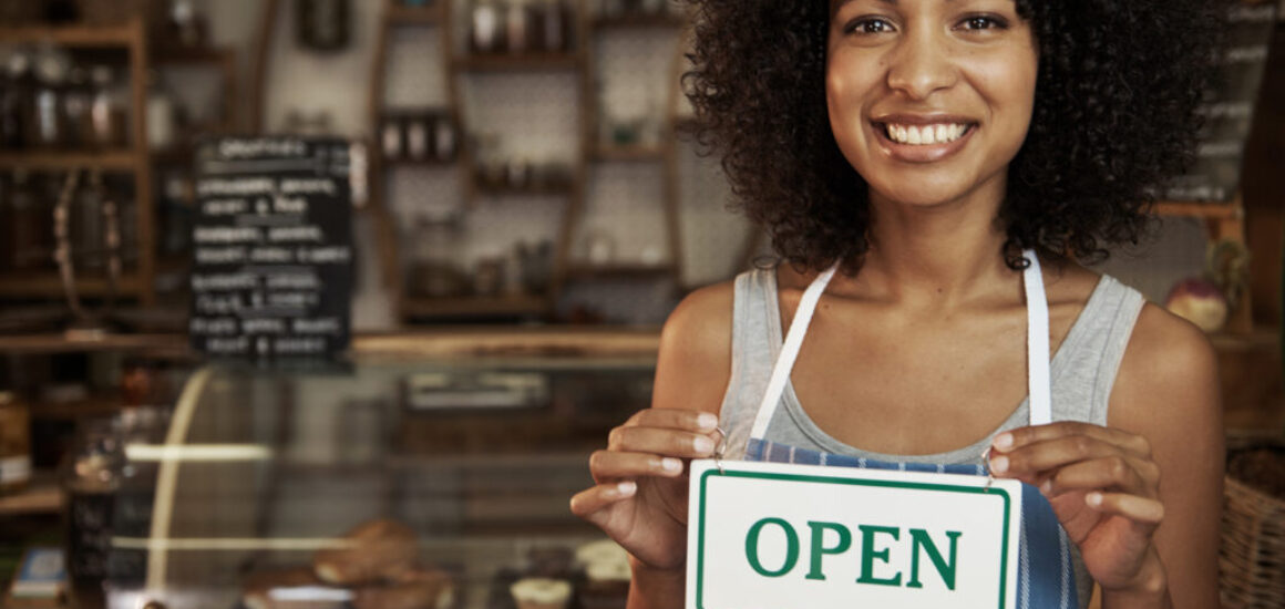 woman-holding-open-sign