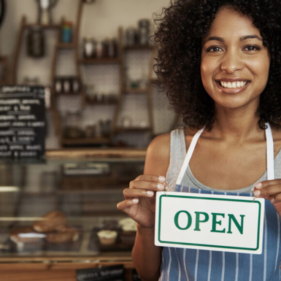 woman-holding-open-sign